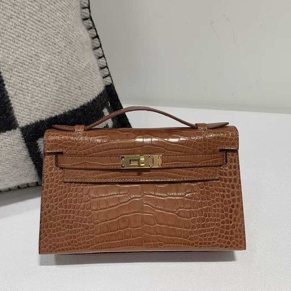 Hermès Kelly Pochette Crocodile Shiny Miel with Gold Hardware